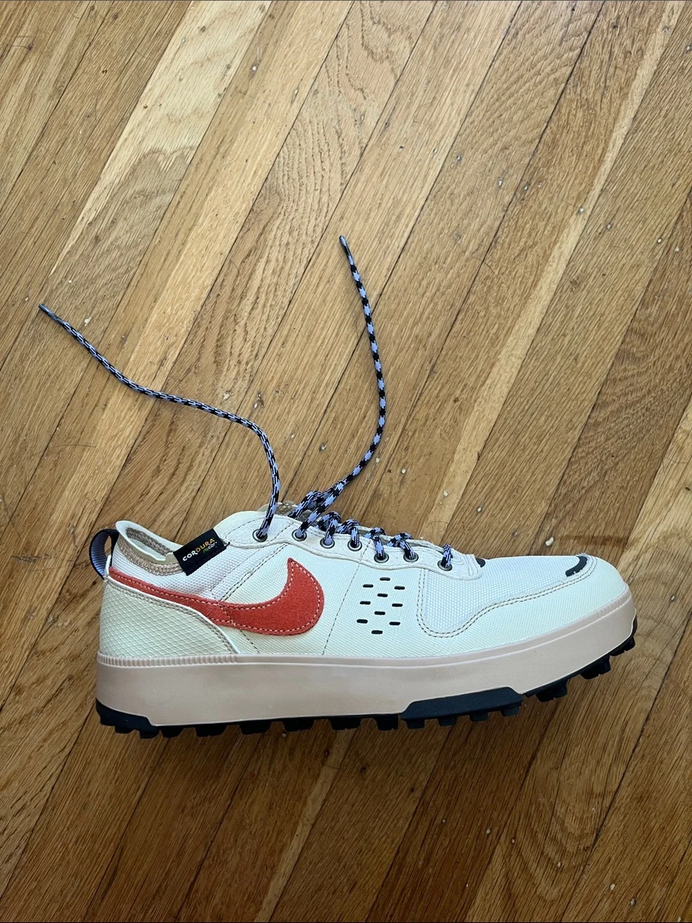 Nike Men's Cream Sneakers with Orange Swoosh and Black Accents